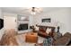 Bright living room featuring a fireplace, hardwood floors, and comfortable seating at 801 Sugar Creek Se Trl, Conyers, GA 30094
