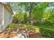 Beautiful backyard with lush landscaping, stone steps, and a view of the charming outdoor seating area at 1028 Amsterdam Ne Ave, Atlanta, GA 30306