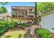 Well-maintained backyard with stone stairs leading to an outdoor sitting area and a multi-level deck at 1028 Amsterdam Ne Ave, Atlanta, GA 30306