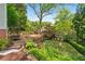 Expansive backyard with a trampoline, swing set, and inviting seating area, ideal for Gathering fun and outdoor activities at 1028 Amsterdam Ne Ave, Atlanta, GA 30306