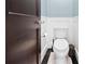 Stylish powder room with a sleek toilet, elegant black-and-white tile floor, and modern fixtures at 1028 Amsterdam Ne Ave, Atlanta, GA 30306