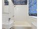 Cozy bathroom with white subway tiles and playful zebra-patterned wallpaper for a touch of whimsy at 1028 Amsterdam Ne Ave, Atlanta, GA 30306