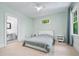Bright bedroom with a neutral color scheme, a cozy bed, and an ensuite bathroom at 1028 Amsterdam Ne Ave, Atlanta, GA 30306