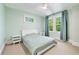 Cozy bedroom with a comfortable bed, two windows with green curtains, and soothing neutral tones for a relaxing atmosphere at 1028 Amsterdam Ne Ave, Atlanta, GA 30306