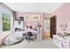 Pink bedroom with a desk, large window, and plenty of storage space at 1028 Amsterdam Ne Ave, Atlanta, GA 30306