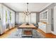 Elegant dining room featuring a wooden table, stylish chairs, and a built-in cabinet for sophisticated dining at 1028 Amsterdam Ne Ave, Atlanta, GA 30306