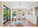 Bright dining room with french doors, chandelier, and a stylish area rug on hardwood floors at 1028 Amsterdam Ne Ave, Atlanta, GA 30306