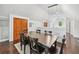 Bright dining area with a large wood table, ample seating, and elegant lighting, ideal for meals at 1028 Amsterdam Ne Ave, Atlanta, GA 30306