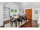 Bright dining room with a large table, built-in shelving, and natural light, perfect for hosting gatherings at 1028 Amsterdam Ne Ave, Atlanta, GA 30306