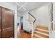 Inviting foyer with hardwood floors, staircase, and contemporary lighting for a stylish entry at 1028 Amsterdam Ne Ave, Atlanta, GA 30306