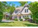 Charming two-story home with a well-manicured lawn and lush landscaping enhancing its curb appeal at 1028 Amsterdam Ne Ave, Atlanta, GA 30306