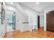Bright hallway with hardwood floors, staircase, and doorways leading to other rooms, offering seamless transitions at 1028 Amsterdam Ne Ave, Atlanta, GA 30306