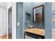 Hallway featuring a mirror, shelving, and drink refrigerator at 1028 Amsterdam Ne Ave, Atlanta, GA 30306