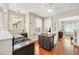 Open kitchen featuring granite countertops, a center island, stainless appliances and hardwood floors at 1028 Amsterdam Ne Ave, Atlanta, GA 30306