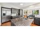 A stunning kitchen featuring granite countertops, stainless steel appliances, and dark wood cabinetry at 1028 Amsterdam Ne Ave, Atlanta, GA 30306