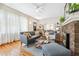 Cozy living room with hardwood floors, fireplace, and an open doorway to the dining room at 1028 Amsterdam Ne Ave, Atlanta, GA 30306