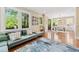 Sun-filled living room with a connected dining area and a comfortable sofa at 1028 Amsterdam Ne Ave, Atlanta, GA 30306