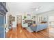 Cozy living room featuring a brick fireplace, hardwood floors, and natural light at 1028 Amsterdam Ne Ave, Atlanta, GA 30306