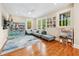 Inviting living room with a cozy sofa and lots of natural light from multiple windows at 1028 Amsterdam Ne Ave, Atlanta, GA 30306