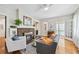 Inviting living room with hardwood floors, fireplace, and an open doorway to an enclosed sunroom at 1028 Amsterdam Ne Ave, Atlanta, GA 30306