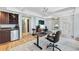 Well-appointed office space with custom cabinets, a wet bar, and a large desk, perfect for working from home or entertaining at 1028 Amsterdam Ne Ave, Atlanta, GA 30306
