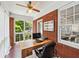Bright sunroom with brick walls, tiled floors, and large windows offering natural light at 1028 Amsterdam Ne Ave, Atlanta, GA 30306