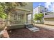 Charming backyard with a covered porch, inviting deck, and a shed providing additional storage at 301 Fortune Ne St, Atlanta, GA 30312