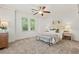 Bright bedroom featuring a bed with neutral linens and soft carpet at 301 Fortune Ne St, Atlanta, GA 30312
