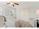 Cozy bedroom offering bright windows, plush carpet, and a stylish accent chair for comfortable relaxation at 301 Fortune Ne St, Atlanta, GA 30312