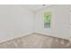 Empty bedroom with neutral carpet and a window at 301 Fortune Ne St, Atlanta, GA 30312