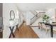 Bright entryway featuring hardwood floors, staircase with iron railings, and elegant decor at 301 Fortune Ne St, Atlanta, GA 30312