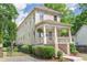Charming two-story home featuring a welcoming front porch and manicured landscaping at 301 Fortune Ne St, Atlanta, GA 30312