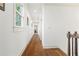 Long hallway with recessed lighting and wood floors at 301 Fortune Ne St, Atlanta, GA 30312