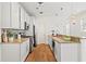 Modern kitchen featuring white cabinets, granite countertops, stainless steel appliances, and stylish backsplash at 301 Fortune Ne St, Atlanta, GA 30312