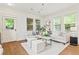 Cozy living room with hardwood floors, bright windows, and comfortable seating at 301 Fortune Ne St, Atlanta, GA 30312