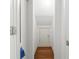Hallway storage under the stairs with a light and dark wood floor at 301 Fortune Ne St, Atlanta, GA 30312