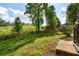 View of backyard with grass and fence line at 5077 Newpark Nw Dr, Acworth, GA 30101