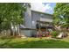 View of home's backyard and deck area with stairs leading to yard at 5077 Newpark Nw Dr, Acworth, GA 30101