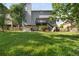 View of the backyard showing a lawn, fencing, and deck at 5077 Newpark Nw Dr, Acworth, GA 30101