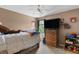 Cozy bedroom featuring a ceiling fan, warm beige walls, and comfortable carpet flooring at 5077 Newpark Nw Dr, Acworth, GA 30101