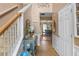 Inviting foyer featuring hardwood floors, decorative accents, and a view into the dining room at 5077 Newpark Nw Dr, Acworth, GA 30101
