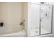 Clean bathroom with a tub and glass shower at 5344 Flat Rock Pt, Stonecrest, GA 30038