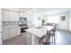 Modern kitchen featuring stainless steel appliances, granite countertops, and a breakfast bar at 5344 Flat Rock Pt, Stonecrest, GA 30038