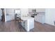 Bright kitchen with granite countertops, stainless appliances, and large island at 5344 Flat Rock Pt, Stonecrest, GA 30038