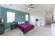 Spacious main bedroom featuring plush carpet, ceiling fan, and a dressing table at 5344 Flat Rock Pt, Stonecrest, GA 30038
