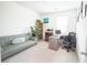 Comfortable office space with a couch, desk, and shelving at 5344 Flat Rock Pt, Stonecrest, GA 30038