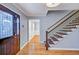 Inviting entryway with hardwood floors, staircase, and decorative front door at 1615 Arden Sw Dr, Marietta, GA 30008
