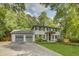 Charming two-story home with a two-car garage, showcasing a well-maintained front yard at 1615 Arden Sw Dr, Marietta, GA 30008
