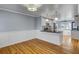 Well-lit kitchen and dining area with island, stainless steel appliances, and hardwood floors at 1615 Arden Sw Dr, Marietta, GA 30008