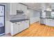 Beautiful kitchen with white cabinets, hardwood floors, and lots of space at 1615 Arden Sw Dr, Marietta, GA 30008